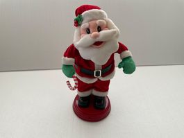 Lustige Santa-/Nikolaus-Figur, musiziert, wackelt mit Po