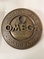 Rare et ancienne plaque en bronze montres Omega Suisse.