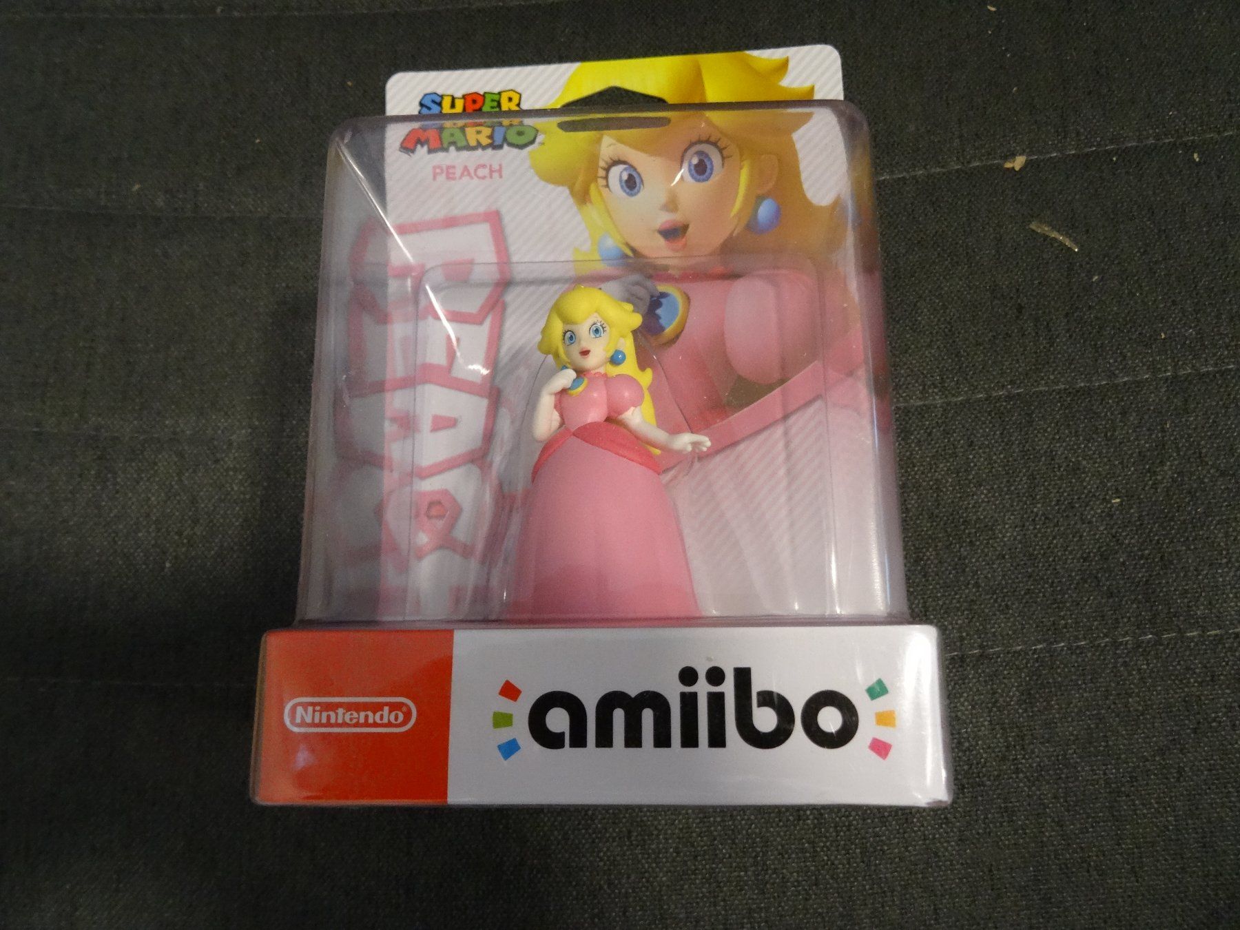 Nintendo Statuette: Amiibo Peach Neuware – Nuovo e nell'imballaggio originale da Olten venduto da Disc-Ausverkauf