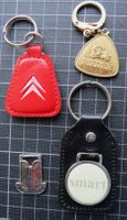4 alte Autoschlüsselanhänger