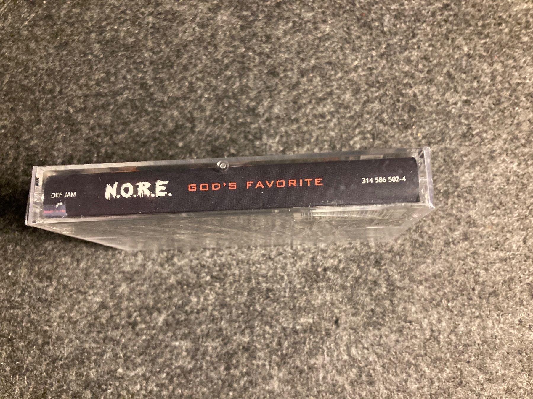 Kompaktkassetten: N.O.R.E. - God's Favorite (MC) – Neu und originalverpackt aus Fribourg von Karushi 1