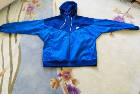 Super stylé et comme neuf, véritable coupe vent NIKE, t. XL