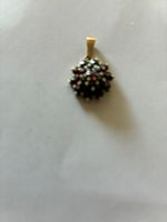 pendentif or jaune 14 carats serties de grenats