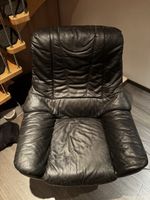 Schwarzer Leder Sessel mit Drehfuss