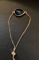 Bracelet doré avec cabochon en verre  bleu