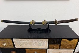 Schwert im Katana-Stil, Gold/Bronze-Dekor, Tsuba als Gesicht