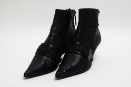 Bottines Christian Dior en cuir noir avec sangle tressée