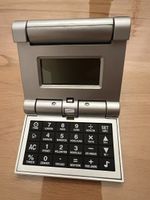 Reise-Rechner mit Weltzeituhr, Top Zustand, Silber