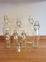 8 Glasflaschen mit Bügelverschluss, verschiedene Grössen