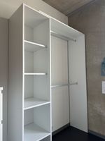 White wardrobe (open) / weisser Kleiderschrank (offen)