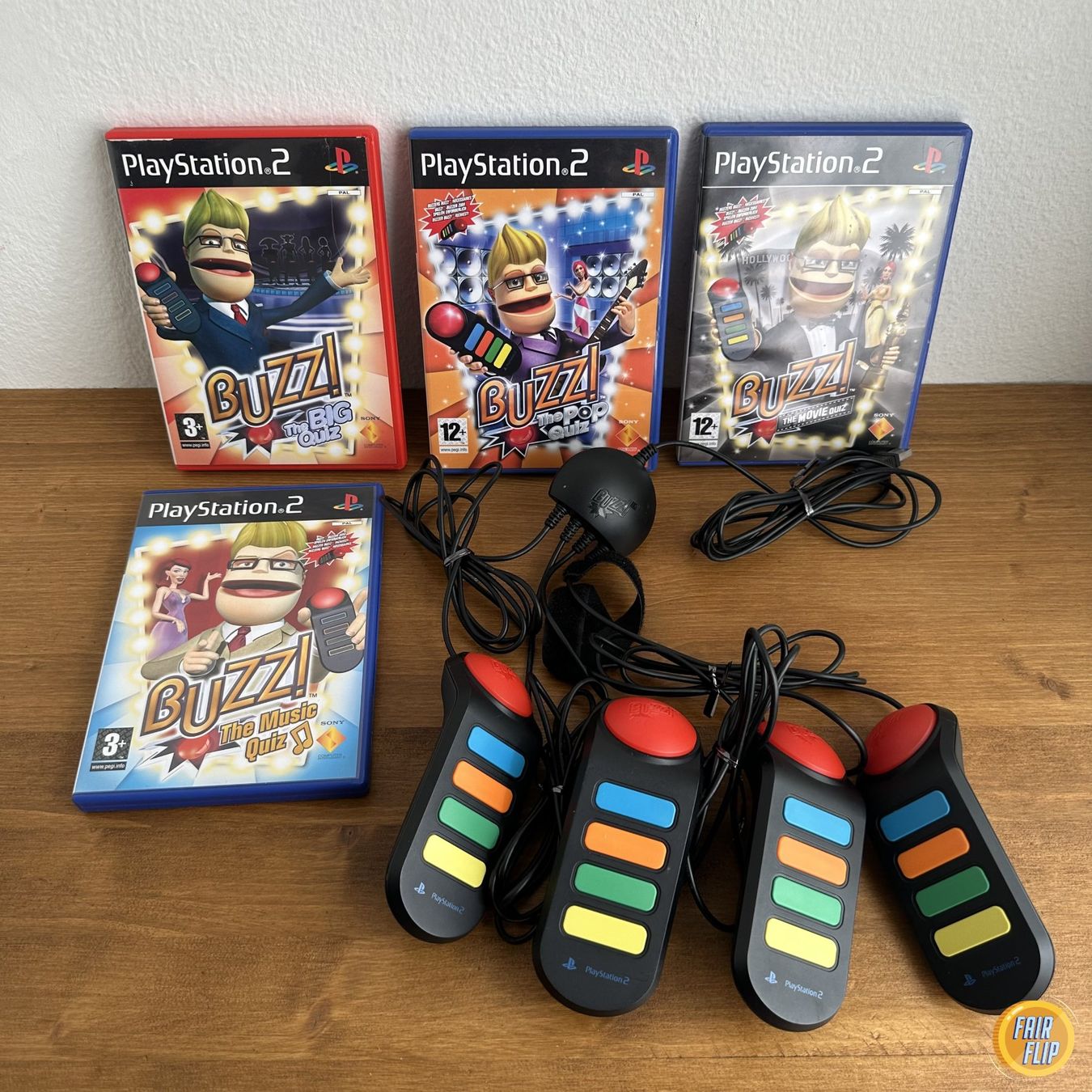 Spiele: PS2 Buzz! 4 Spiele Set + 4 Buzzer – Gebraucht aus Luzern von fairflip