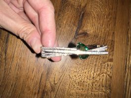 Elegantes Armreif mit Smaragd-Akzent, neuwertig!
