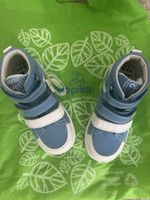 Kapika Type: High-top sneakers/boots with Velcro straps.