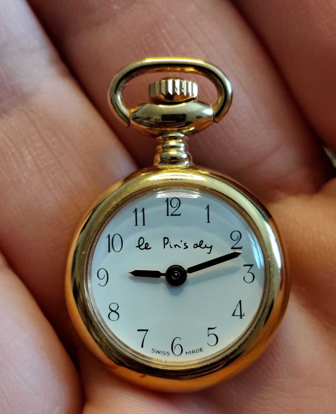 Orologi: Mini montre : "Le Pin's oly" – Usato da Neuchatel venduto da Vale-1976