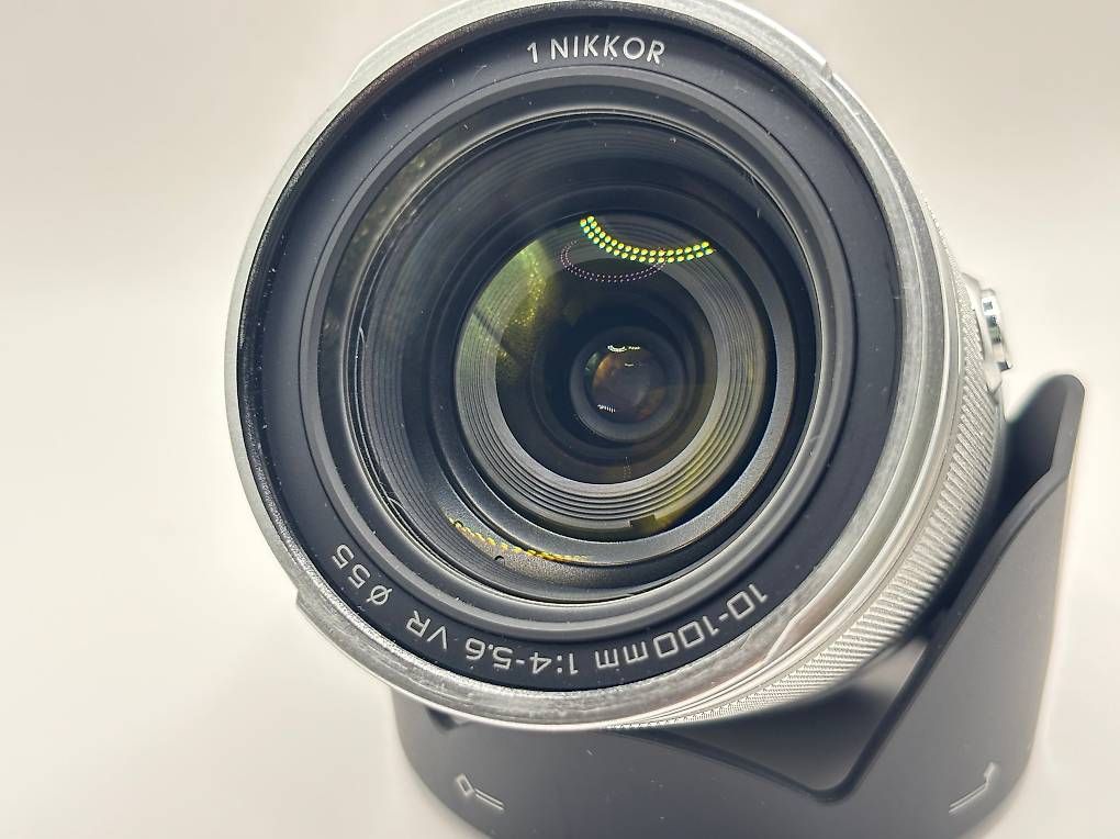 Nikon Obiettivi: Nikon 1 NIKKOR 10-100mm VR Silber – Usato da Merenschwand venduto da Sbj 2