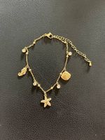 18K vergoldetes Fusskettchen mit Muschel Charms