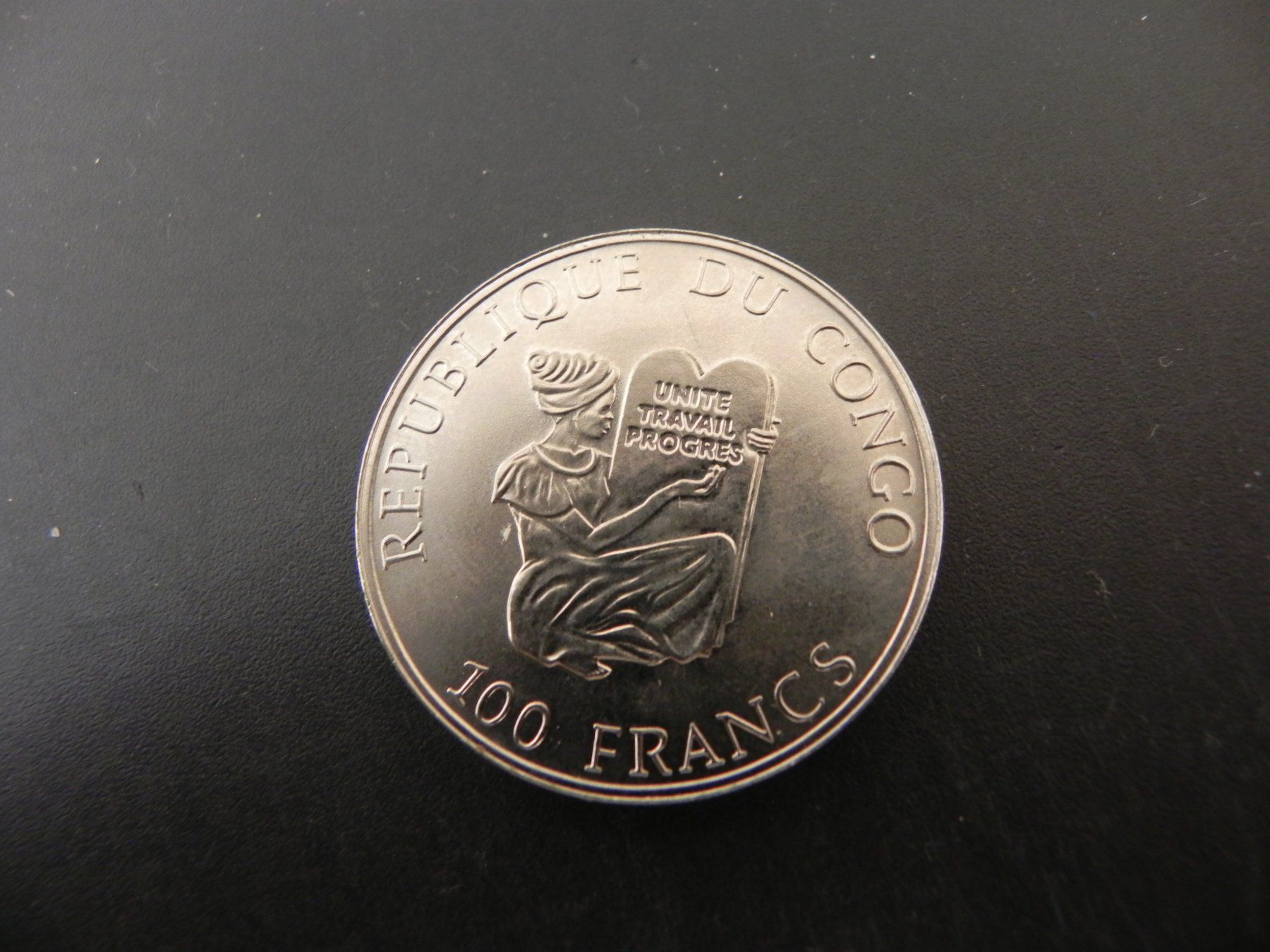 Tutti le monete: Congo 100 Dollars 1995 - Junkers JU 52 – Usato da Biel/Bienne venduto da Gogolozi 1