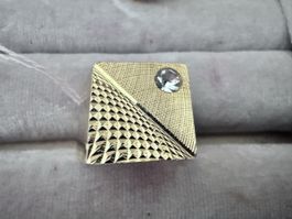 Cufflink, gold-colored, one stone, used