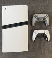 PlayStation 5 Pro with two controllers