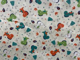 Tissu coton blanc cassé imprimé dinosaures
