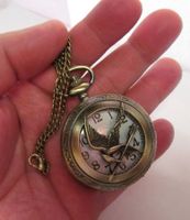 Umhängeuhr Taschenuhr Tribute von Panem Spottölpel NEU