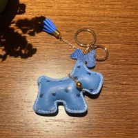 Hübscher Hunde-Schlüsselanhänger, blau, Quaste, neuwertig