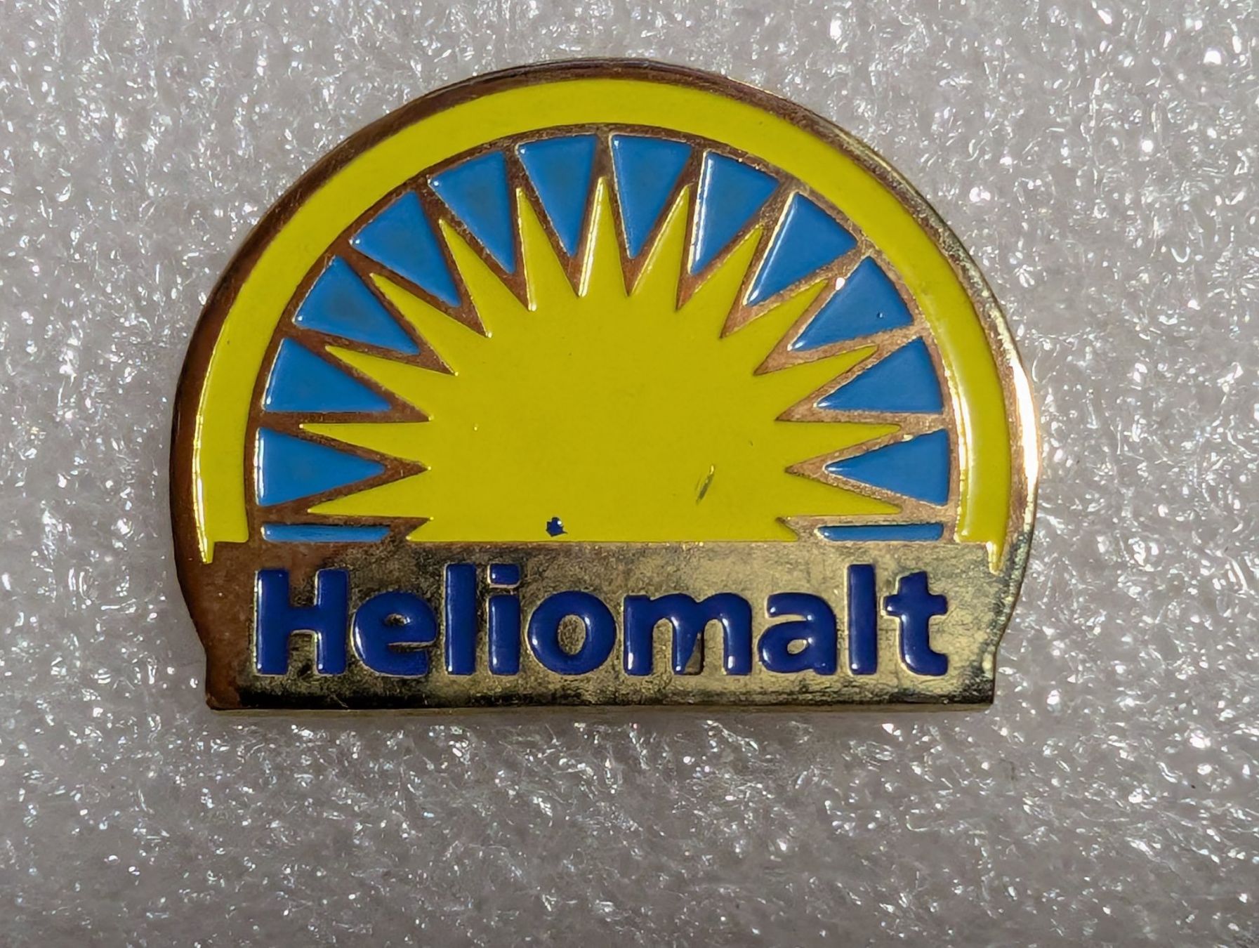 Placchette & Badge: Ansteckpin 265: Heliomalt – Usato da Oppligen venduto da Pin-Fall-Shop