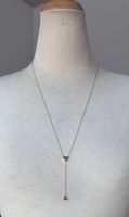 Necklace with heart charm .