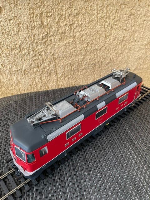 Hermann Modellini di ferrovie: Re 4/4 rot Hermann – Nuovo e nell'imballaggio originale da Schlieren venduto da Kasimir19 3