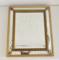 Wandspiegel mit facettiertem Glas
