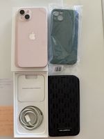 Apple iPhone 13 Pink with accessories