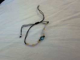 Armband mit Nazar Auge Perlen schwarz gold