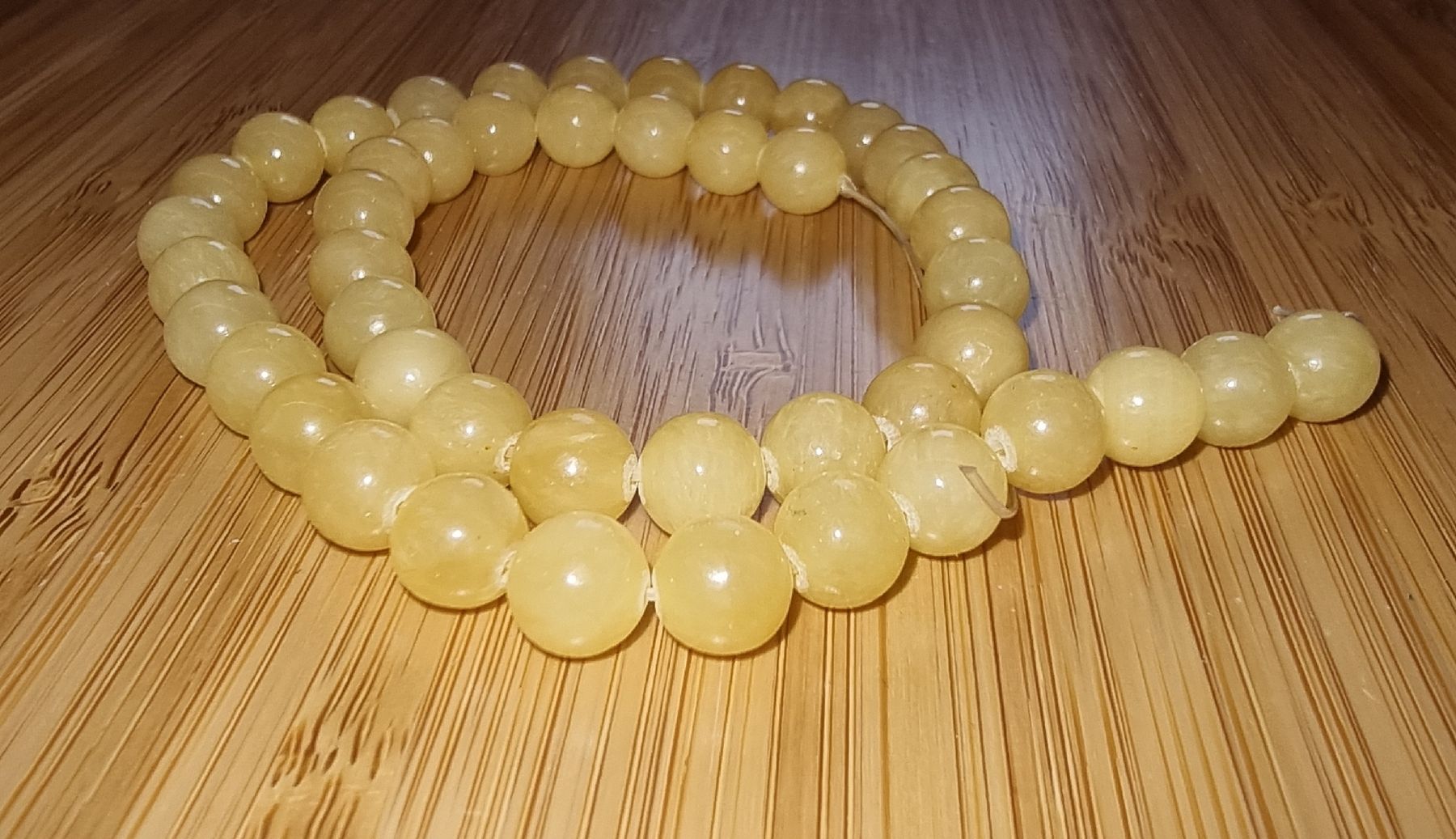 Minerali & Pietre curative: Calcit 8mm. Strang – Nuovo e nell'imballaggio originale da Menziken venduto da Mirager