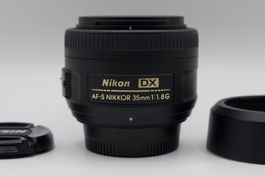 Nikon AF-S DX NIKKOR 35mm f/1.8G + Pare-soleil Nikon