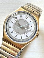 Swatch Swiss Damenuhr mit Datum und Wochentag Goldfarben