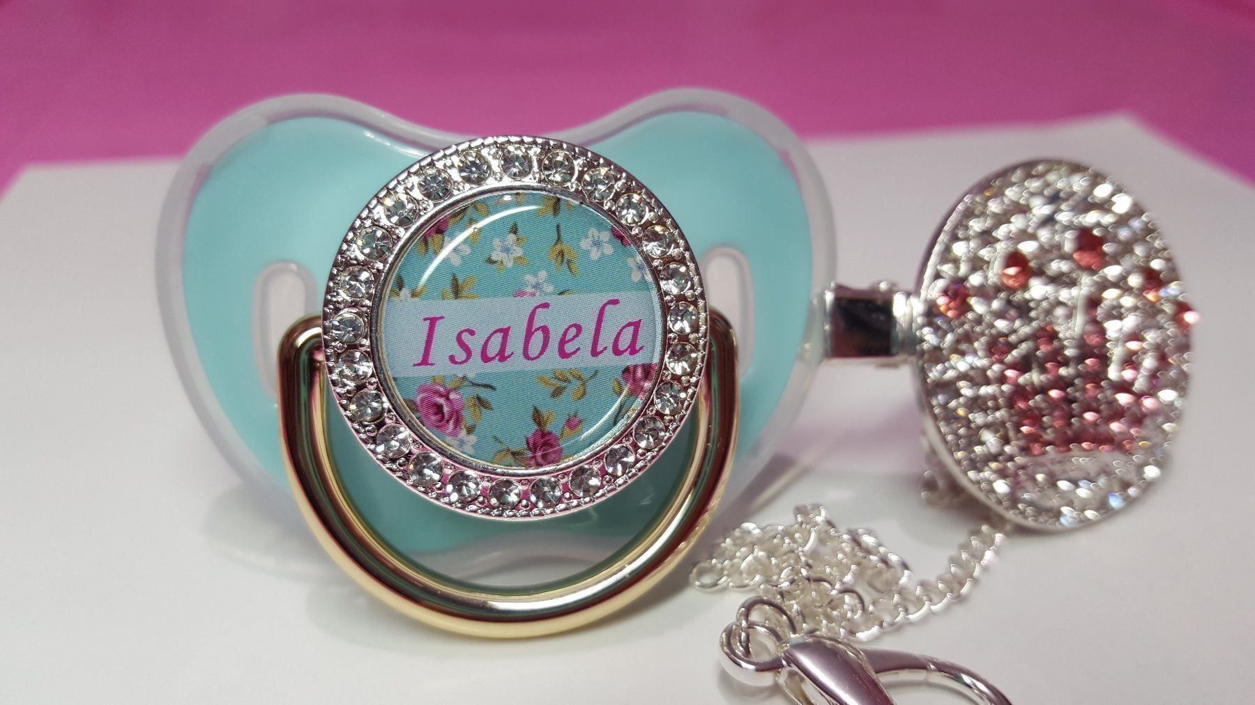 Succhiotti & catenelle porta ciuccio: Name Isabela Bling Nuggi Schnuller – Nuovo e nell'imballaggio originale da Uster venduto da BellaBimbaQ