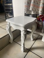 White accent table with ornate legs, good condition