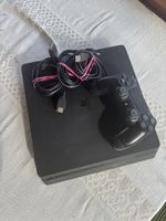 PS4 with controller and cables 