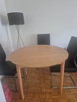 Table ronde avec 2 extensions