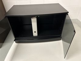 Schwarzes TV-Möbel GRUNDIG mit Glas-Türen und Rollen