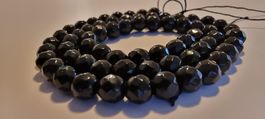 Onyx schwarz facettiert 6mm. Strang