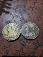 2 pièces de monnaie de 2 sols