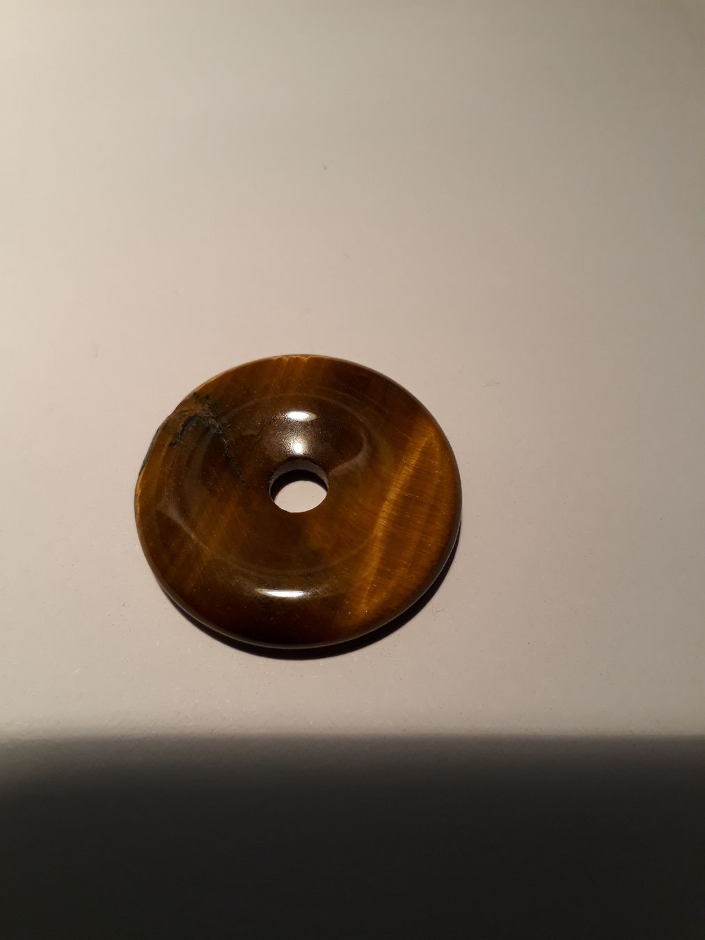 Minerali & Pietre curative: Tigerauge Pi-Ring oder Donut – Nuovo e nell'imballaggio originale da Zürich venduto da Gillheri