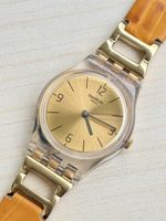 Swatch Uhr goldfarben mit Lederarmband braun 