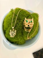 Ring und Anhänger mit grünem Pantherauge, neu (komplett)