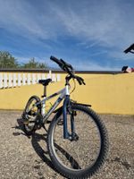 Velo enfant Rockrider blanc bleu bon etat general