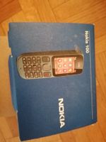 Nokia 100 mobile phone with charger and manual