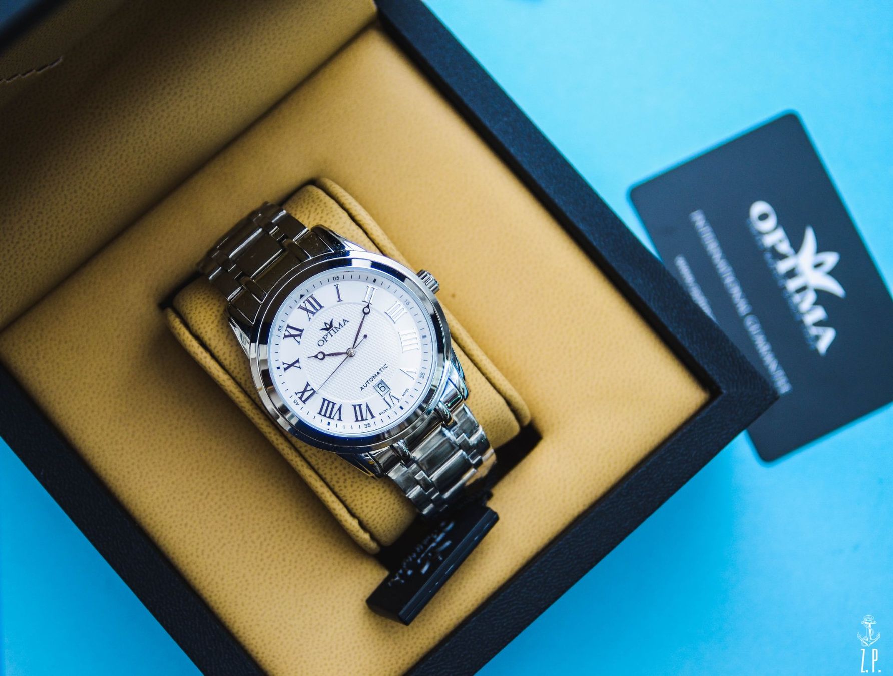 Uhren: Optima Automatic Roman White Dial Ungetragen Swiss made – Gebraucht aus Boswil von ZPwatches