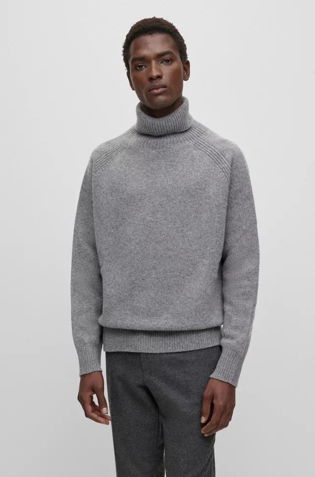 Hugo Boss Maglioni & Felpe: BOSS ALL-GENDER RELAXED-FIT PULLOVER AUS SCHURWOLLE – Nuovo e nell'imballaggio originale da Zürich venduto da luxuryoutlet1 1