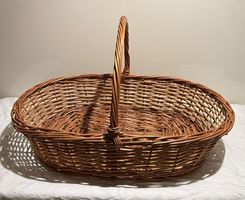 Korb geflochten oval mit Henkel braun